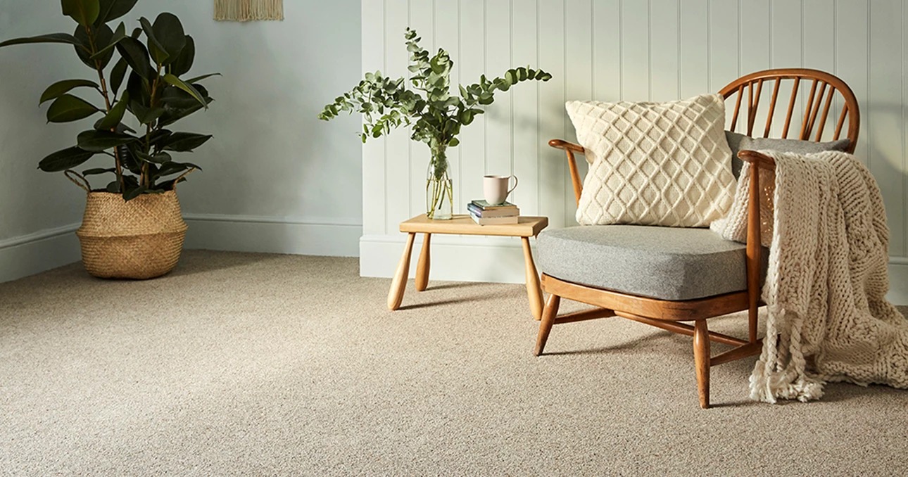 Beige twist-pile carpet fitted in a bright living room, KSC Carpets installation